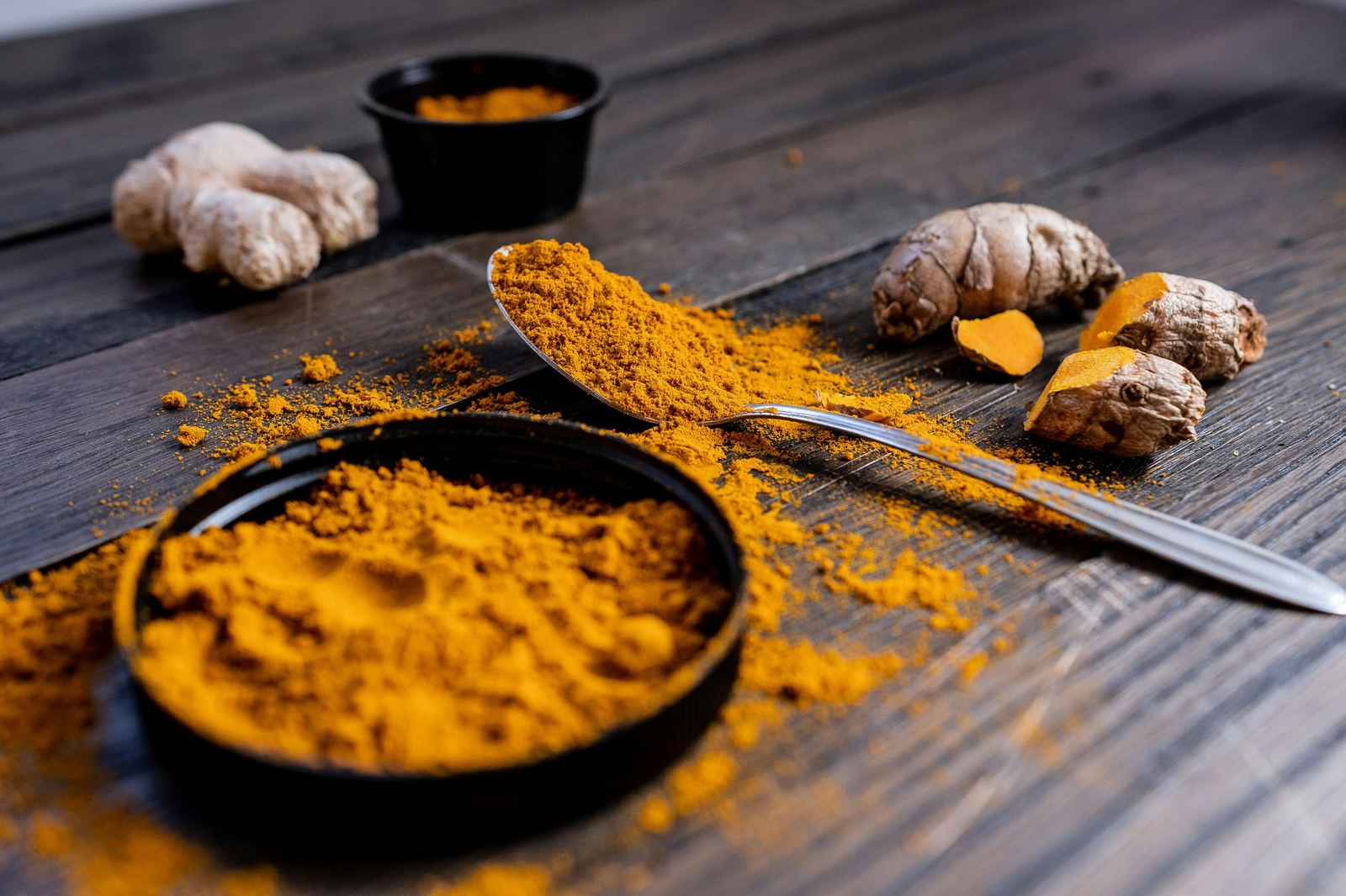 Fresh ginger and turmeric — anti-inflammatory roots that ease cramps and reduce bloating